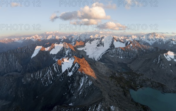 Evening mood, mountain panorama, aerial view, 4000 metre peak with glacier, mountain pass and