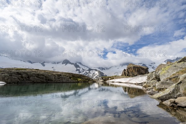 Mountains and glaciers reflected in the Schwarzsee lake, Schwarzensteinkees and Hornkees glaciers,