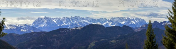 Panoramic view of the snow-covered Alps photographed from the Hochgern summit, at Lake Chiemsee in