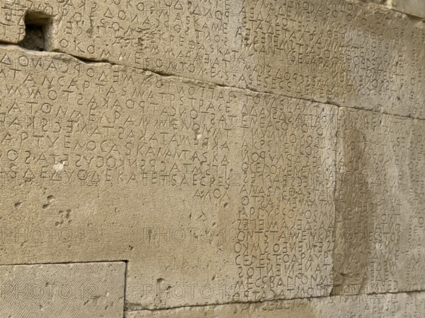 Detailed view of sandstone blocks Stones made of sandstone with written laws carved into the wall