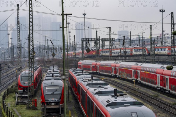 Railway tracks with regional trains, after freezing rain, in front of Frankfurt main station,