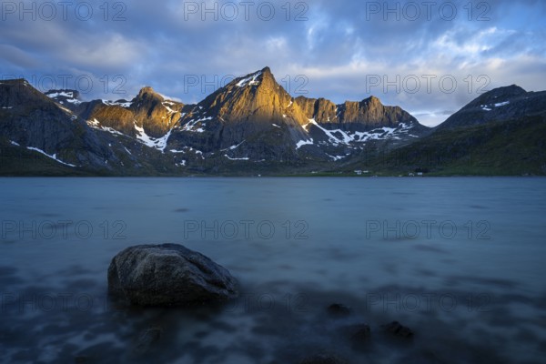 Landscape with sea and mountains on the Lofoten Islands, view over the fjord Flakstadpollen to the