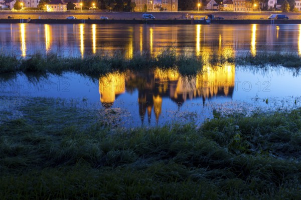 Reflection of Bischofsburg, Albrechtsburg and cathedral in the water of the Elbe at blue hour,