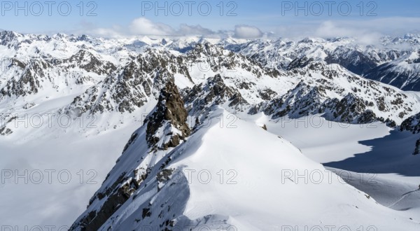 View of mountain panorama in winter on Piz Kesch with glacier Vadret da Porchabella, high tour, ski