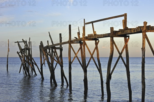 Remains of wooden walkway of traditional carrelet fishing hut on the beach, Loire-Atlantique,