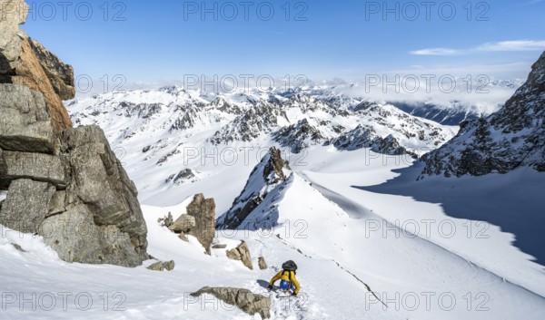 Mountaineer with ice axe and crampons, ascent through steep snowfield to Piz Kesch or Piz d'Es-cha