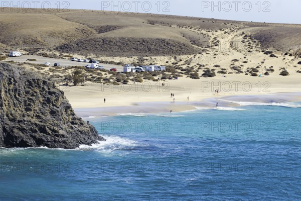 Papagayo beach with blue sea and dunes in a secluded coastal landscape, Playa Blanca, Lanzarote,