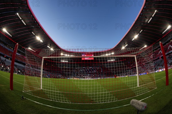 Overview, interior, floodlit match, behind-the-goal perspective, goal net, blue hour, fisheye shot,