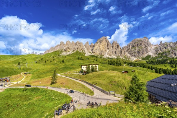Breathtaking view of the majestic dolomites group mountains and the winding road of passo gardena