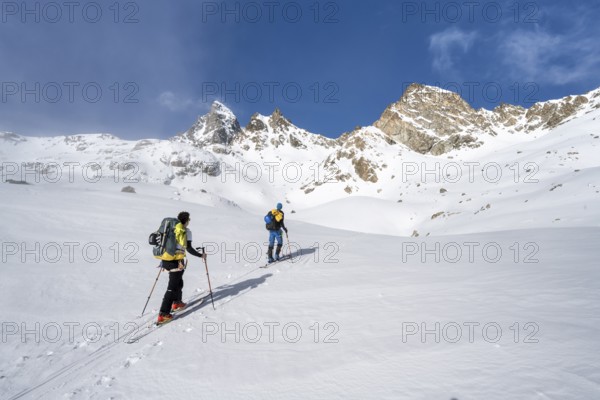 Ski tourers in a wintry mountain landscape, ascent to Porta d'Es-cha, Grisons Haute Route ski tour,