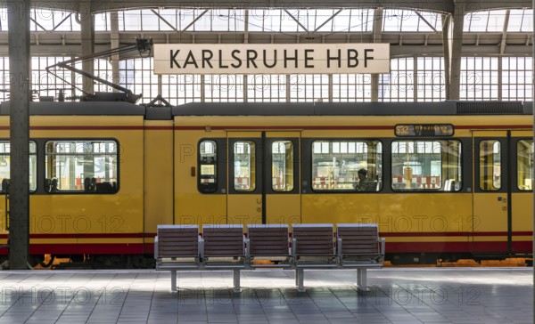 Karlsruhe main station, platform with station sign. Tram in the Karlsruhe public transport network