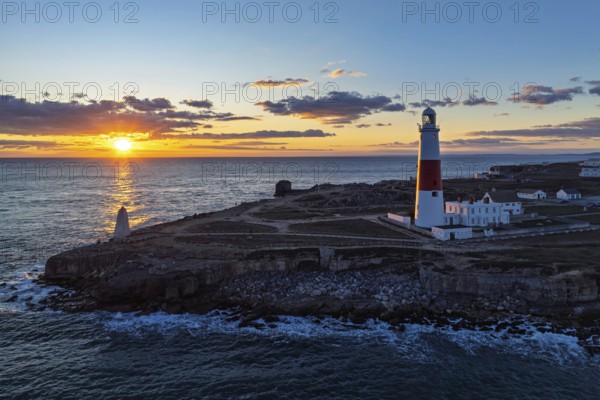 Sunset over Portland Bill Lighthouse from a drone, Portland Bill, Isle of Portland, Dorset,