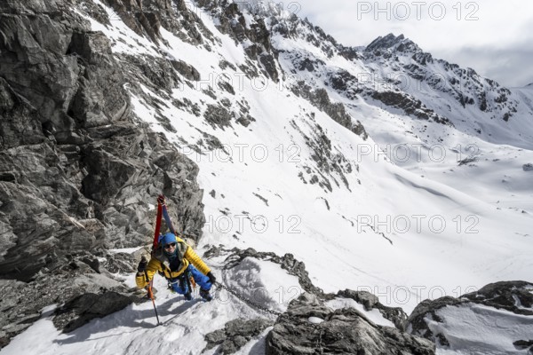 Climbers with skis ascending a steep snow slope to the Porta d'Es-cha saddle, Bündner Haute Route