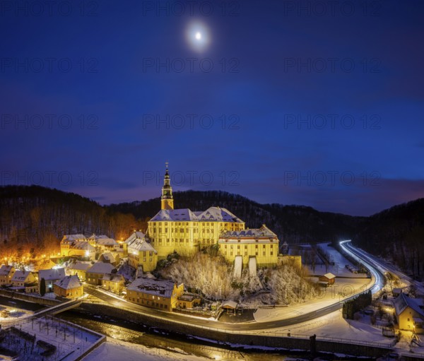 Winter evening in the Müglitz valley, impressively illuminated Weesenstein Castle at the blue hour,