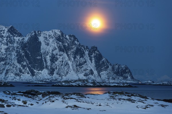 Moonrise, winter landscape, Lofoten island Vestvågøya at the fjord Gimsøystraumen, Lofoten,
