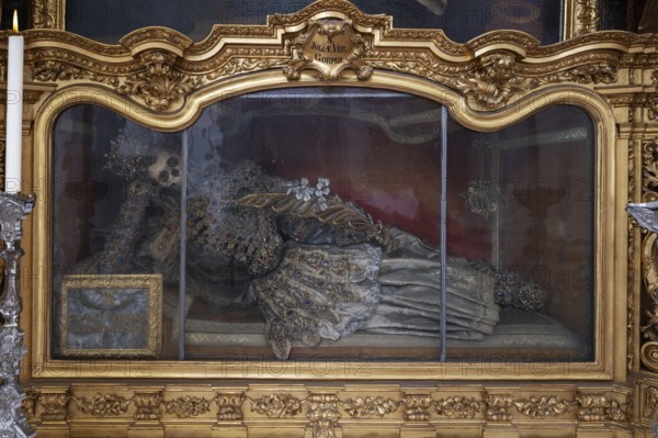 Magnificent glass shrine with decorated bones of a catacomb saint, Basilica of St Mauritius,