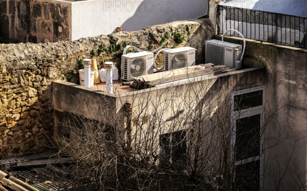 View of Mediterranean houses, roofs and courtyards from the town wall, Alcudia, Majorca, Spain,