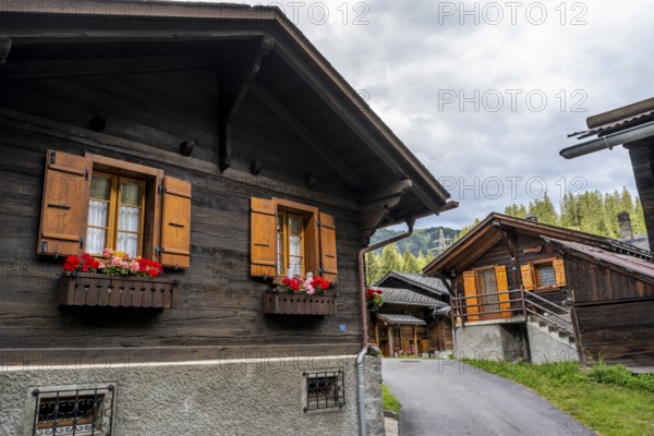 Traditional wooden houses in the mountain village of Fionnay, Val de Bagnes, Valais, Western Alps,