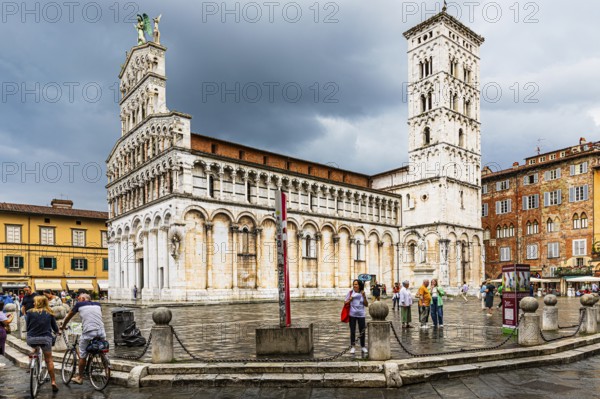Rain clouds over the church and Piazza San Michele, historic city centre, Lucca, Tuscany, Italy,