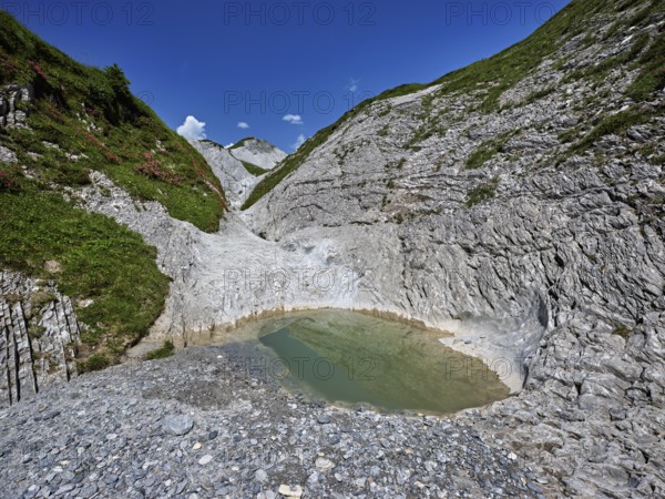 Glacier mill with glacier pots on the Trinser Alp Mora, Trin, Canton Graubünden, Switzerland,