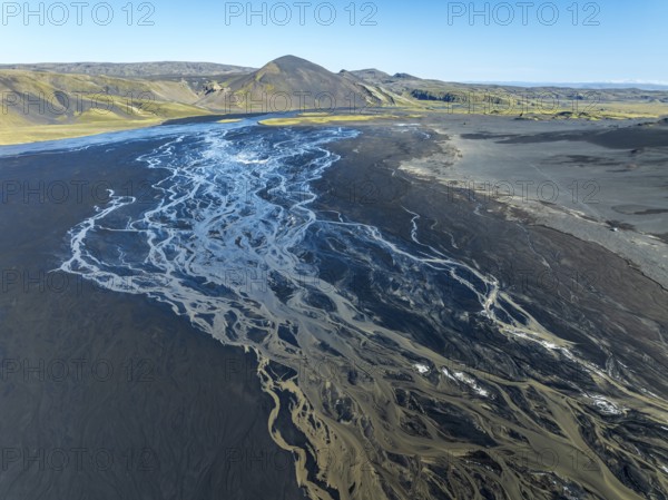 Aerial view, glaicial streams flow across Mælifellssandur, black sand desert, Icelandic highlands,