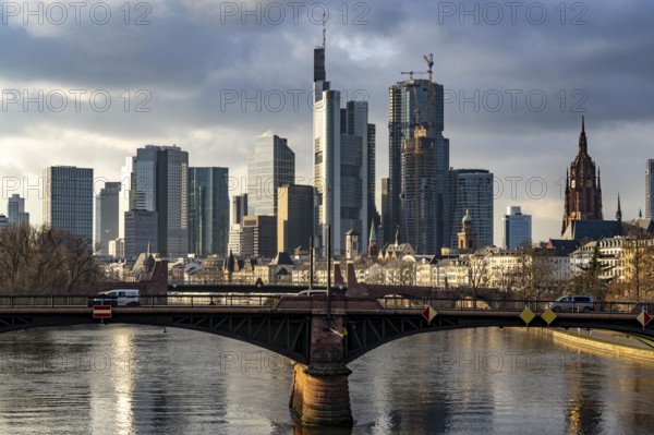 Skyline of the city centre of Frankfurt am Main, river Main, Ignatz-Bubis-Bridge, dusk, Hesse,