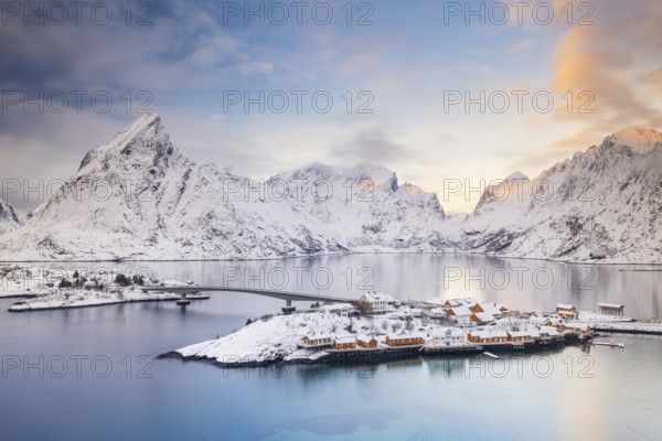 View of snow-covered islands, fjord and mountains, fishing village Sakrisøy, Reine, Reinefjord,