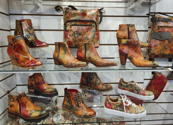 Shelf full of colourful shoes and handbags in a vibrant style, La Boca district, Buenos Aires,