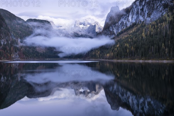 The Vordere Gosausee lake in autumn with a view of the Dachstein mountain range. The Gosaukamm on
