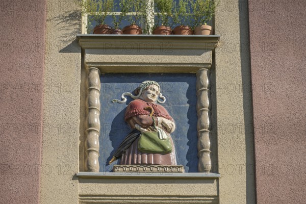 Midwife, relief on old building, former woman's and children's clinic, today St. Marien residential