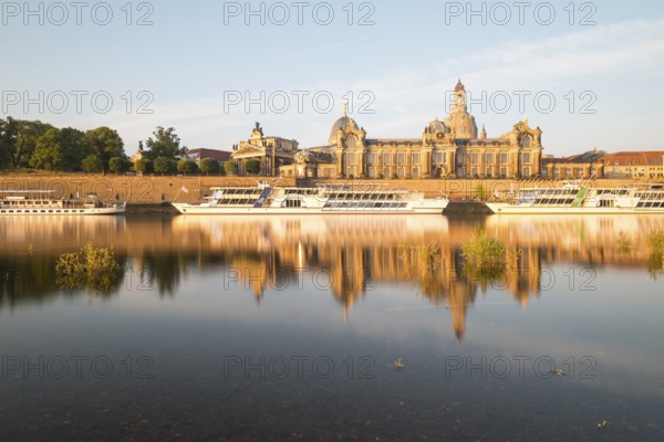 Silhouette of the Old Town with reflection in the Elbe in the morning, steamboats on the