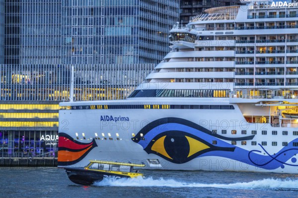 Cruise ship Aida Prima at the Cruise Terminal of Rotterdam, Kop van Zuid, skyscrapers at the