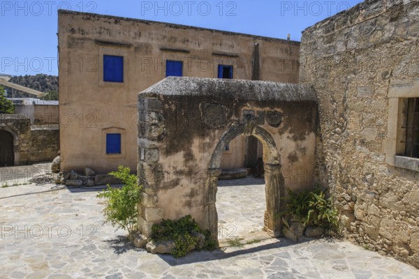 View of old historical Tor tor behind building with blue shutters of Ethnological Museum, Vori,
