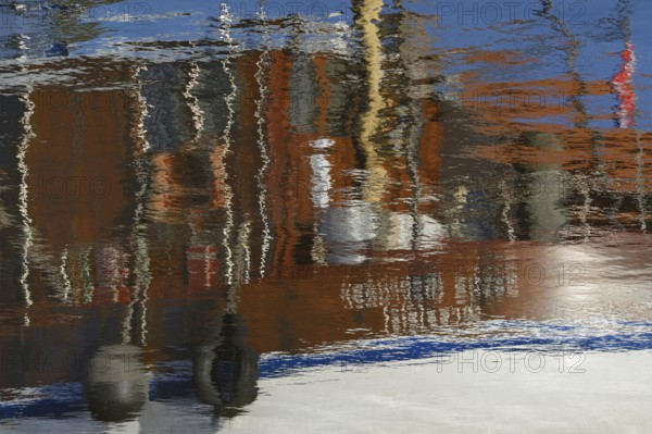 Reflection, colourful reflections on the water surface, maritime impressions, Greetsiel, North Sea,