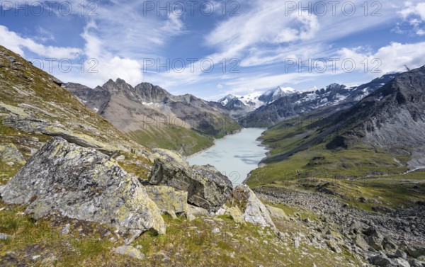 Picturesque mountain landscape, view of a blue mountain lake, Lac des Dix reservoir, behind