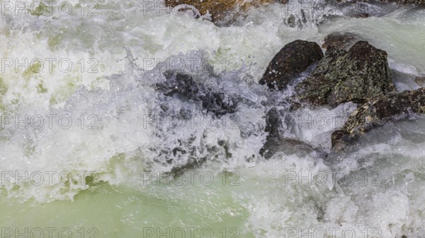 Dark boulders in a glacial stream, near Grimentz, Val d'Anniviers, Valais Alps, Canton Valais,