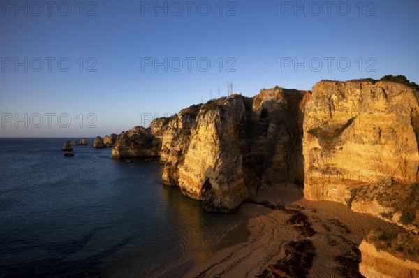 Colourful cliffs and rocks at sunrise on the beach, Praia da Dona Ana, Lagos, cliffs, Atlantic