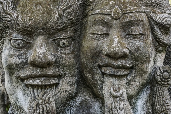 Temple figure, couple, woman, man, Hinduism, tongue, long, outstretched, facial expression, stone,