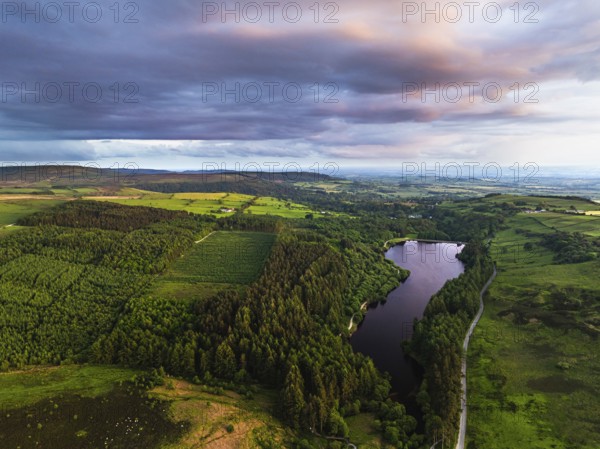 Sunset over Cod Beck Reservoir from a drone, North York Moors National Park, North Yorkshire,