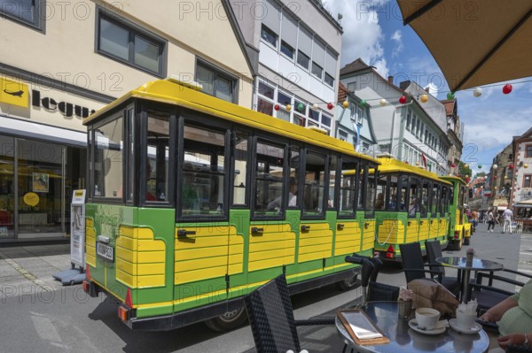 Tourist train runs through the town centre of Bad Kissingen, Lower Franconia, Bavaria, Germany,