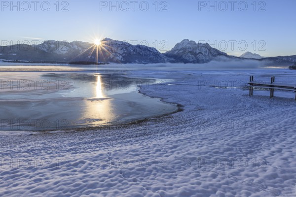 Sunrise at a lake in front of mountains, footbridge, snow, winter, Forggensee, Königswinkel, view