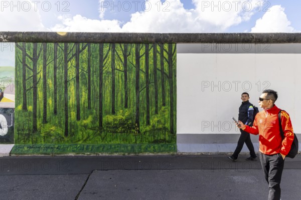 East Side Gallery. Remnant of the Berlin Wall, designed by artists. Landmark and city view Berlin,