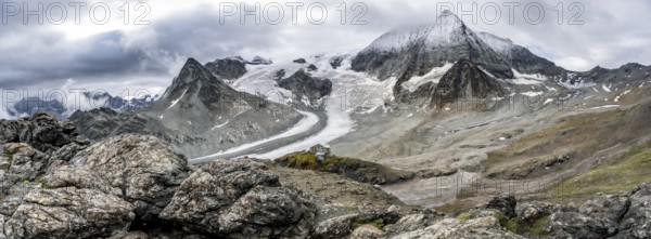 Mountain hut Cabane des Dix in front of glacier Glacier de Cheilon and summit Mont Blanc de