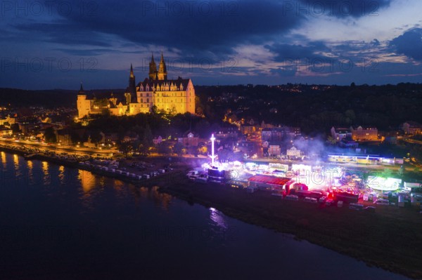 Albrechtsburg Castle and hustle and bustle on the Elbe for the wine festival, night shot from