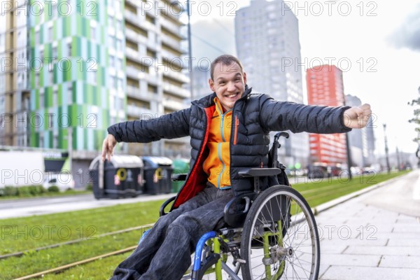 Young disabled man is joyfully navigating the city in his wheelchair, embracing independence and