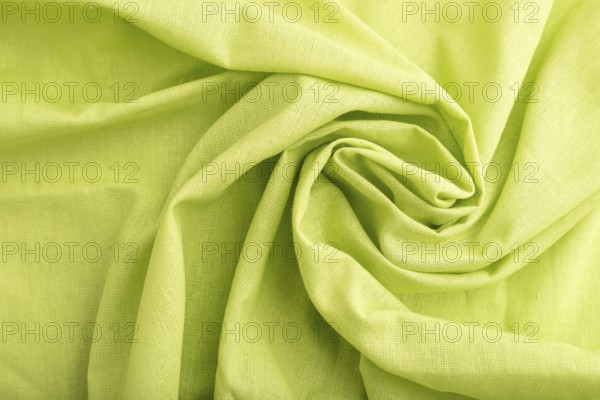Fragment of green linen tissue. Top view, flat lay, natural textile background and texture. wave