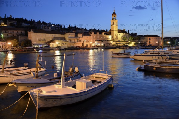 Fishing boats in the harbour of Sutivan front of the Sveti Ivan Church, Sutivan, Island Brac,
