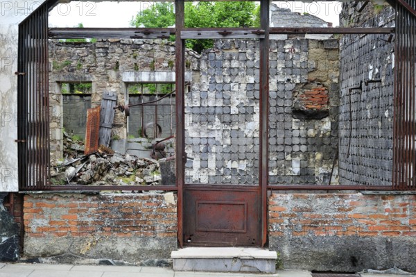 Burnt-out butcher's shop. The burnt village of Oradour-sur-Glane was destroyed on 10 June 1944 when