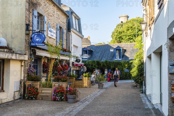 Pont-Aven, France, August 5, 2018: Picturesque street in the walled medieval town. Sunny day