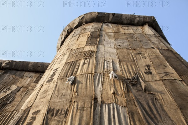 Torwache wrapped with old jute sacks, Check Point Sekondi Loco, by artist Ibrahim Mahama, documenta